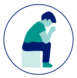 Person sitting with head in hands icon